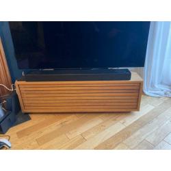 Oiled oak corner TV stand with slatted front