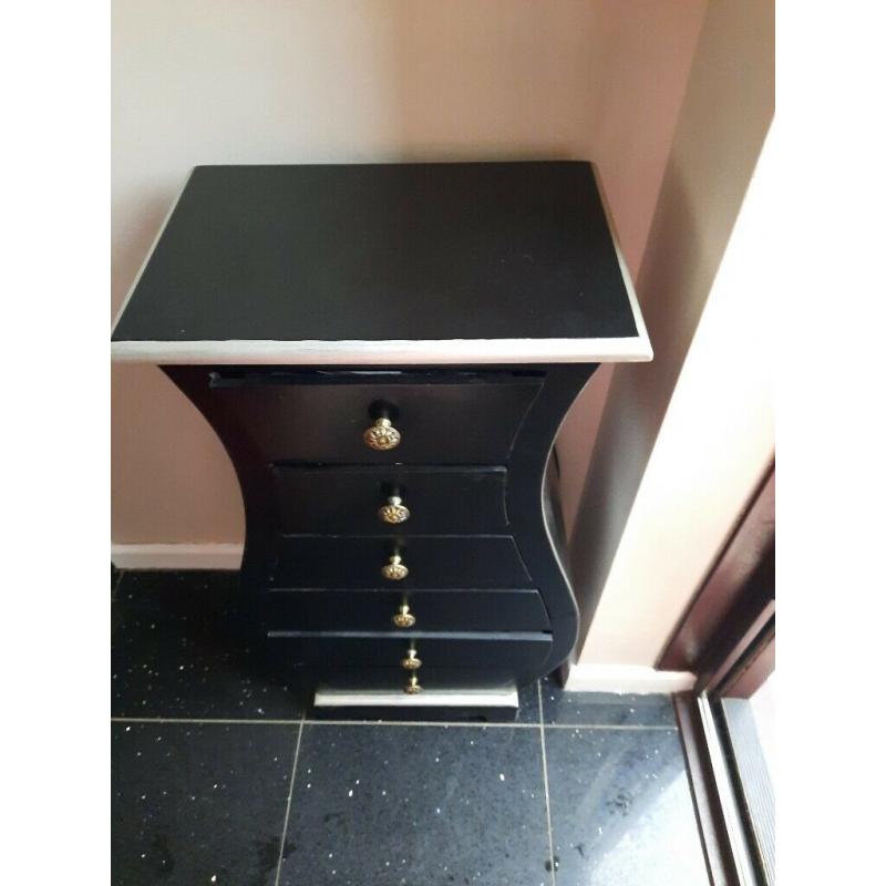 small unusal shaped set of drawers