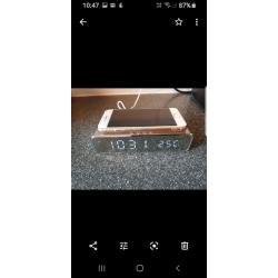 Wireless clock phone charging system