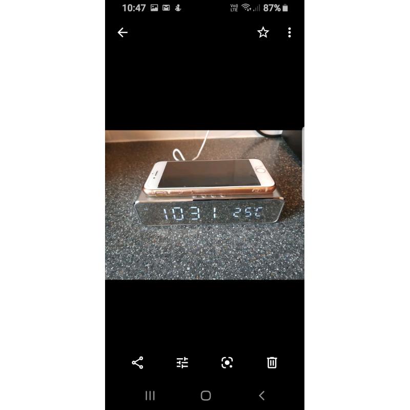 Wireless clock phone charging system