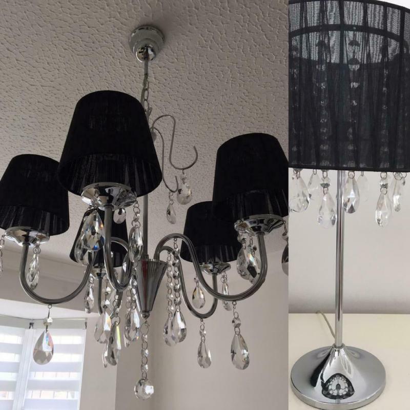 Ceiling Chandelier with bedside lamp.